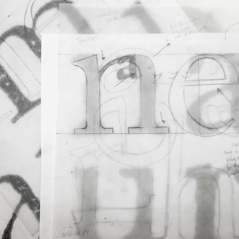 Redrawing of the letter “n” on vellum, overtop of previous versions.